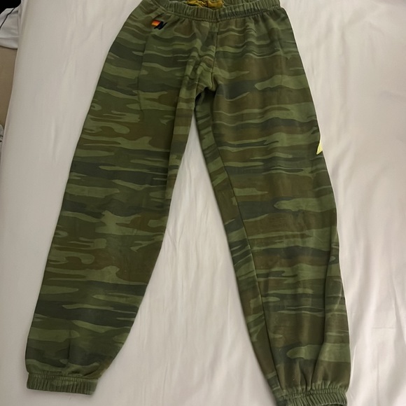 Aviator Nation Pants - Aviator nation camouflage sweatpants with lightning bolt on the left pant leg.